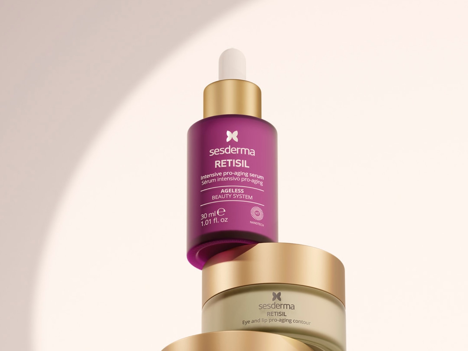 Fioletowe serum Sesderma Retisil Intensive pro-aging z pipetą na kremie pod oczy i usta z tej samej serii, oferujące intensywną pielęgnację przeciwstarzeniową.