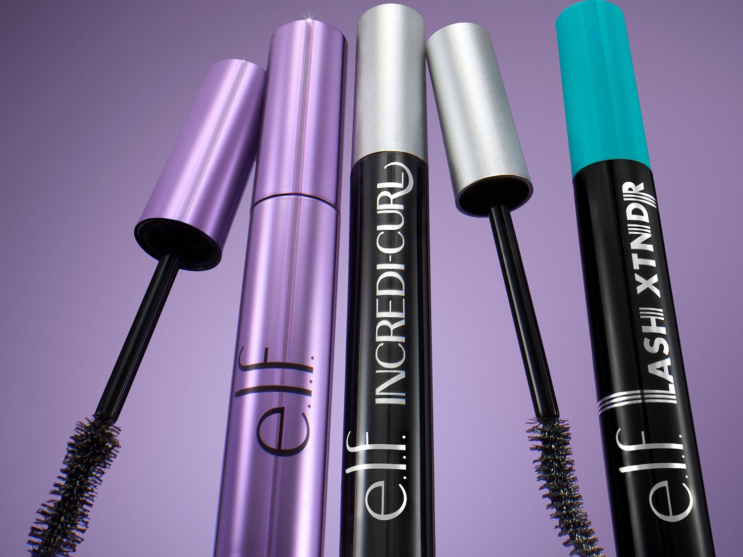 Ecco quattro mascara di e.l.f. Cosmetics: uno viola, uno nero con tappo argento, un altro nero con tappo turchese, tutti con scovolino nero, per ciglia definite e intense.