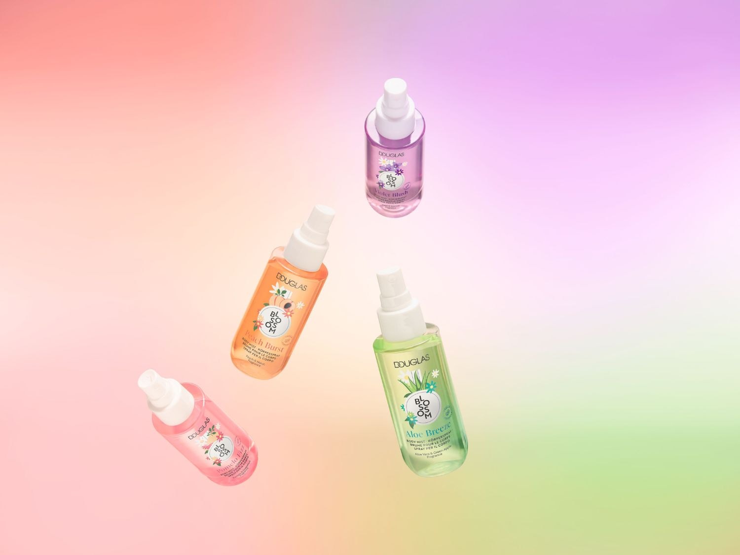 A Douglas Blossom testpermetek lebegnek a levegőben, köztük az Aloe Breeze, a Peach Burst és a Violet Blush, mindegyik a maga frissítő illatával.