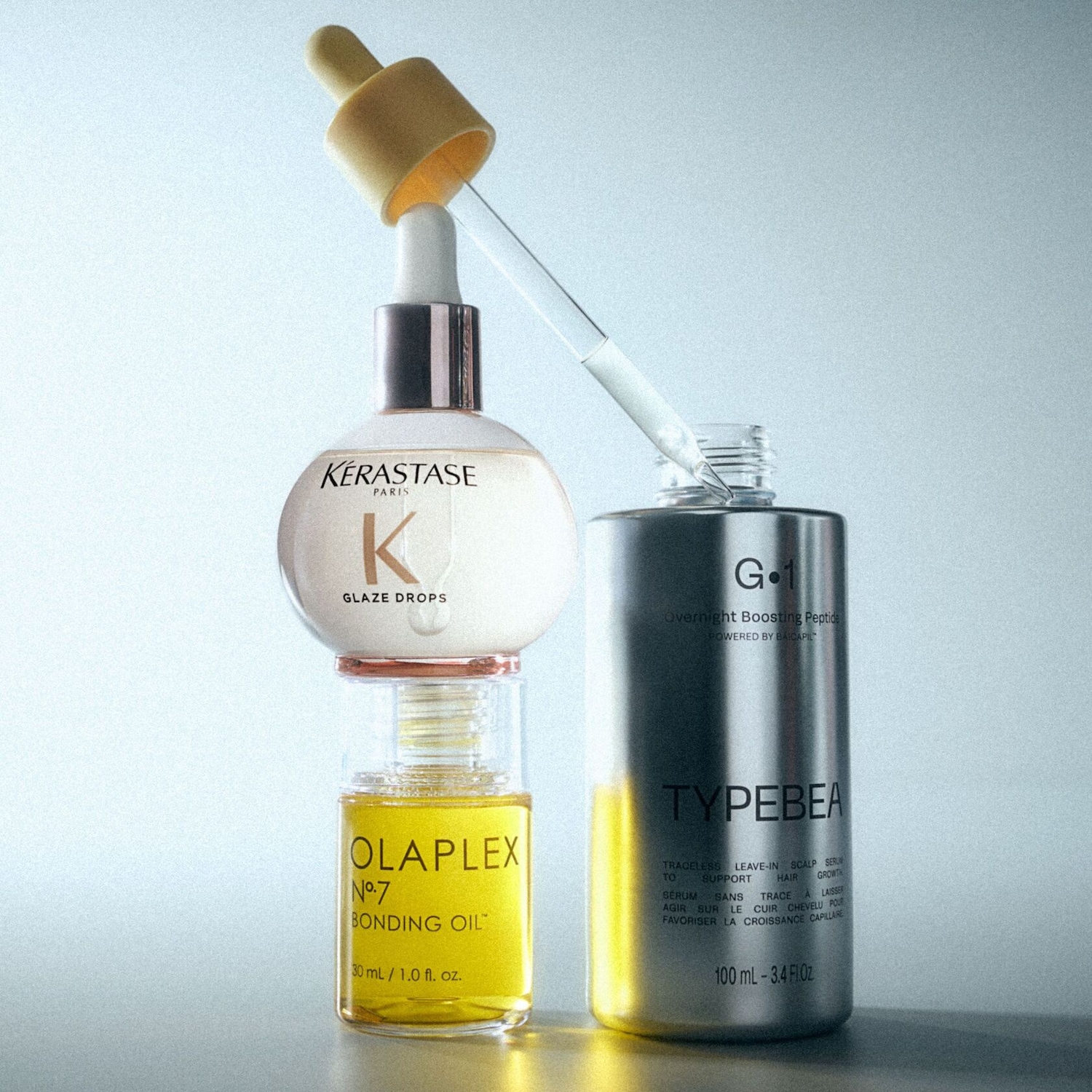 Découvrez un assortiment de soins capillaires : Kérastase Glaze Drops, Olaplex Bonding Oil N°7 et Typebea Overnight Boosting Peptide pour nourrir et sublimer vos cheveux.