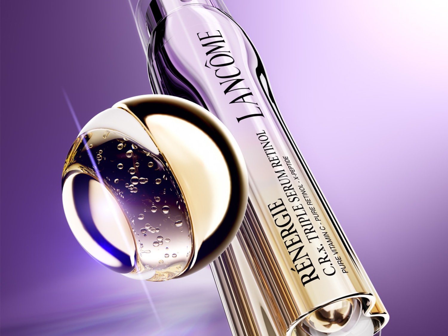 Ecco il siero Rénergie C.R.x Triple Retinol di Lancôme, con vitamina C pura, retinolo puro e X-peptide, presentato in un flacone dorato e viola.