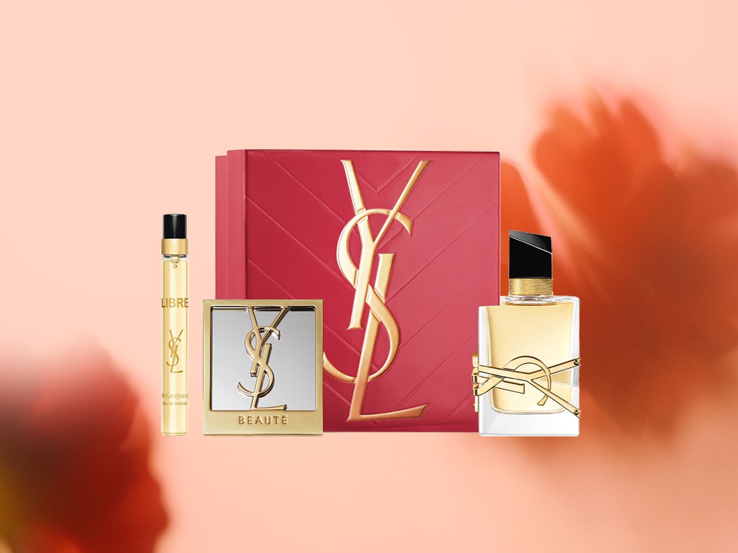 Découvrez l'élégance avec le coffret Yves Saint Laurent, comprenant un parfum, un vaporisateur de voyage et un miroir compact, le tout orné du logo emblématique YSL.
