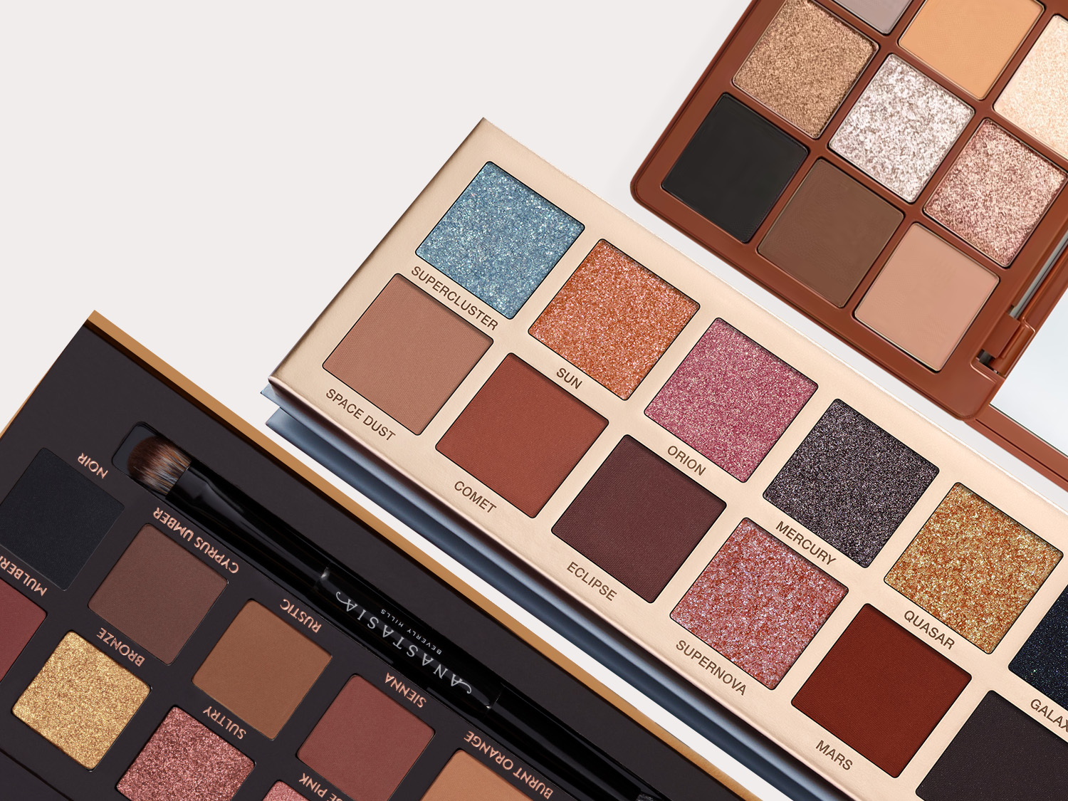 Paleta cieni do powiek Anastasia Beverly Hills w odcieniach brązu, złota i różu, z nazwami takimi jak Supercluster, Sun i Orion, oferująca szeroką gamę kolorów do makijażu oczu.