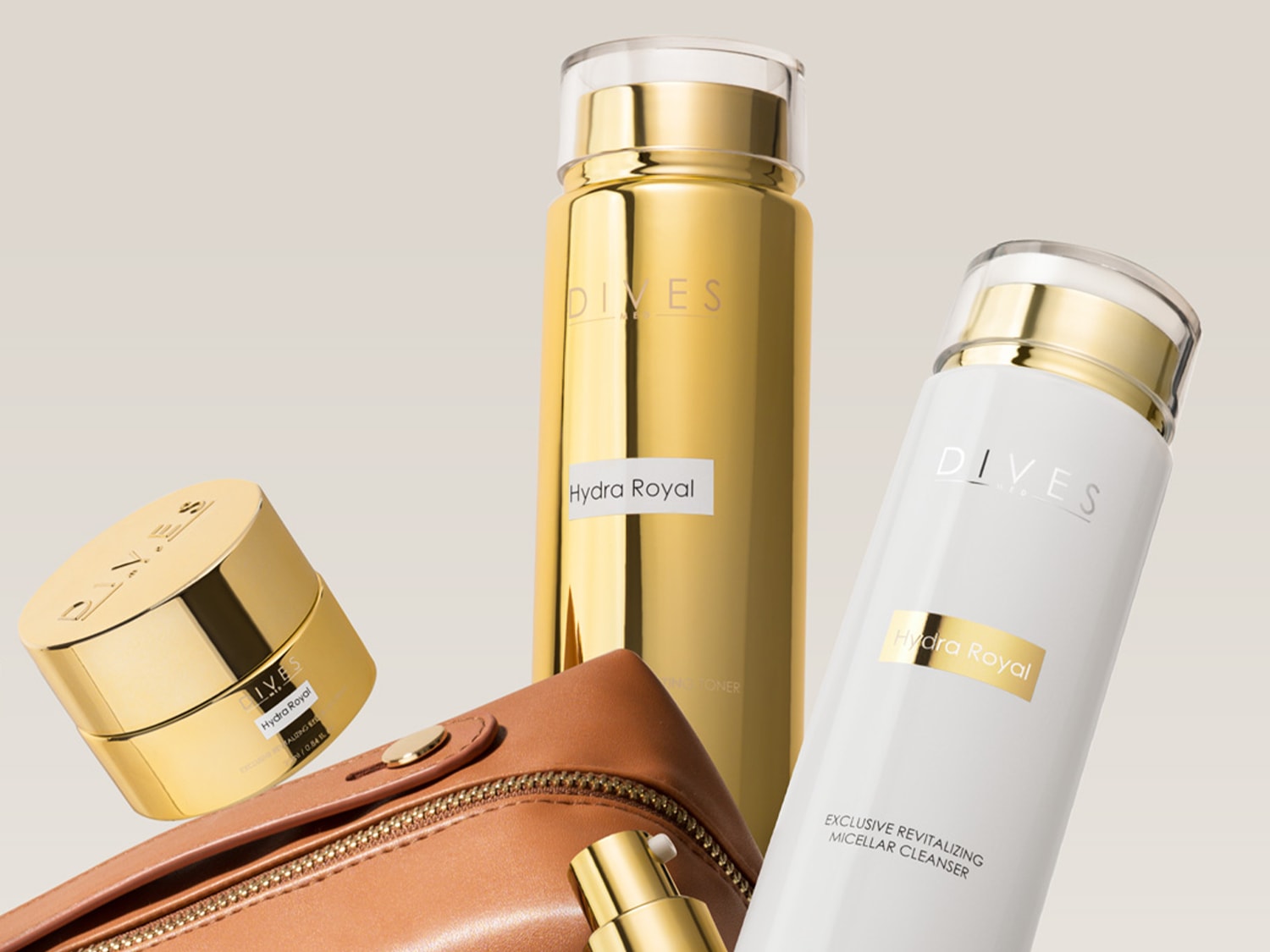Zestaw kosmetyków Dives Hydra Royal w złotych i białych opakowaniach, zawierający krem, tonik i płyn micelarny, idealny do pielęgnacji skóry.