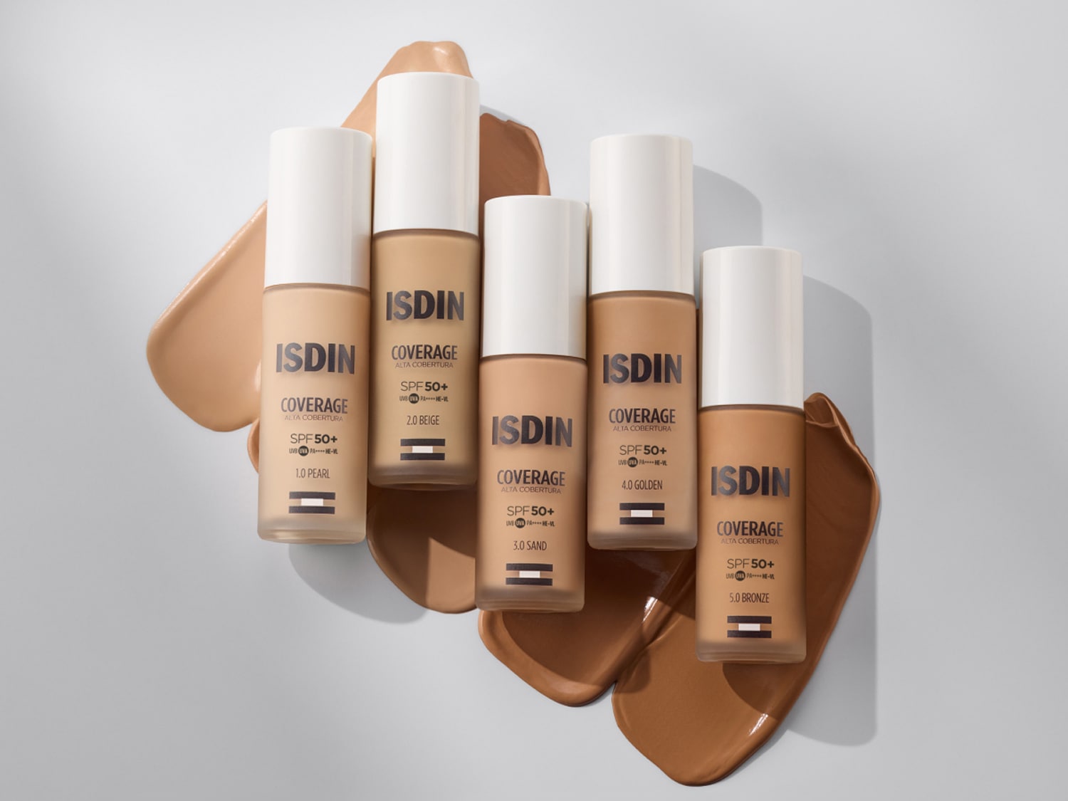 Descubre ISDIN Coverage, alta cobertura con SPF50+ en tonos 1.0 Pearl, 2.0 Beige, 3.0 Sand, 4.0 Golden y 5.0 Bronze.