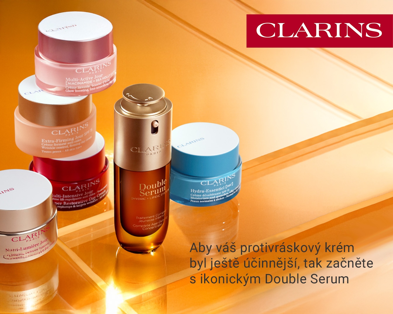 Řada produktů péče o pleť Clarins, včetně Multi-Active Jour, Extra-Firming Jour SPF 15, Nutri-Lumière Jour, Multi-Intensive Jour, Double Serum a Hydra-Essentiel [HA], pro zářivou a hydratovanou pleť.