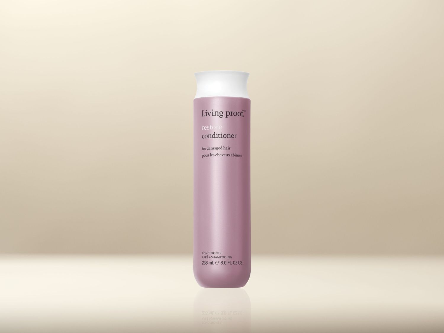 Voici un revitalisant Living Proof Restore pour cheveux abîmés, présenté dans un flacon rose de 236 ml avec un bouchon blanc.