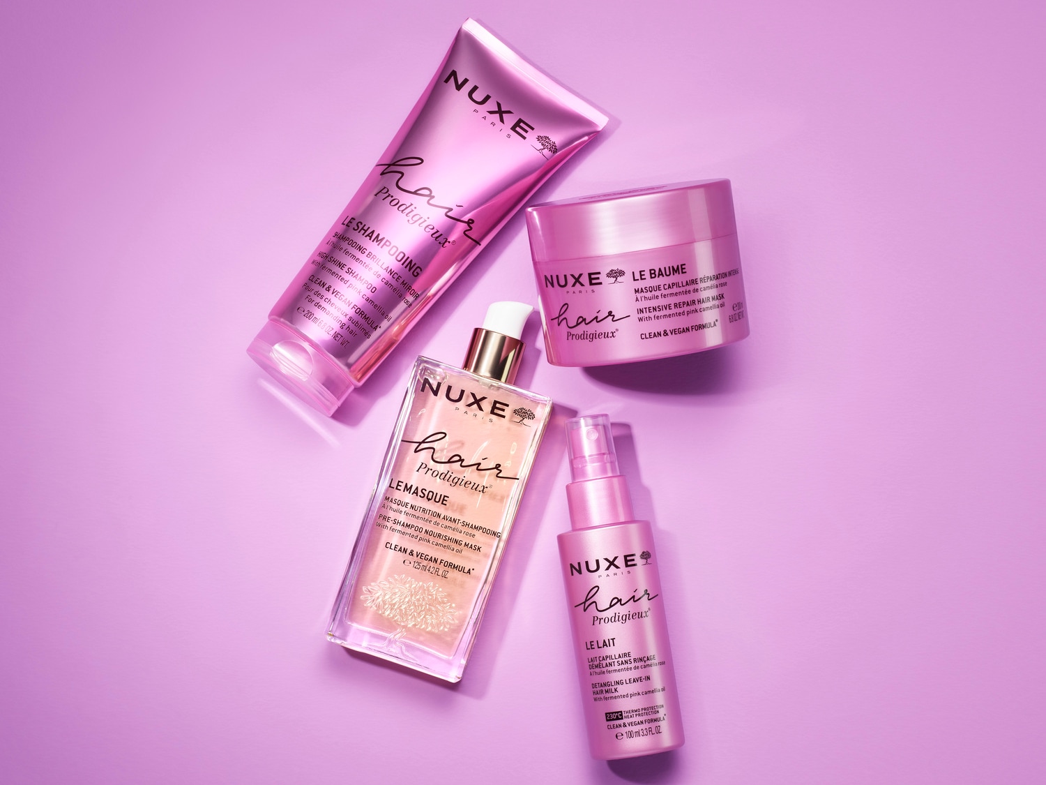 Découvrez la gamme Nuxe Hair Prodigieux, comprenant un shampooing brillant, un masque réparateur intensif, un masque nourrissant avant-shampooing et un lait capillaire démêlant sans rinçage, tous à l'huile fermentée de camélia rose.