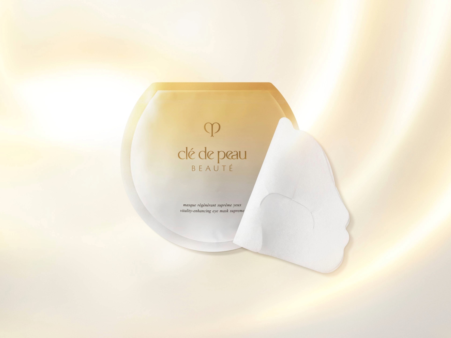 Voici le masque régénérant suprême yeux Clé de Peau Beauté, conçu pour revitaliser et illuminer le contour des yeux.