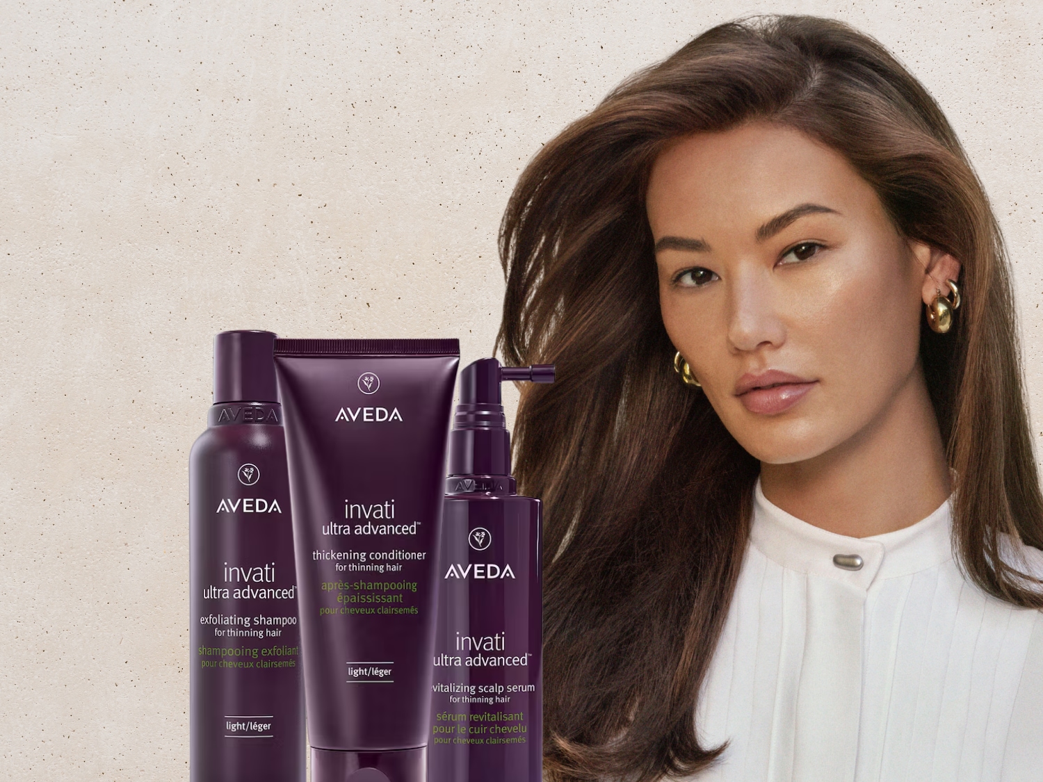 Aveda Invati Ultra Advanced haarverzorgingslijn, bestaande uit shampoo, conditioner en hoofdhuidserum in paarse verpakkingen, gepresenteerd naast een model met glanzend bruin haar.