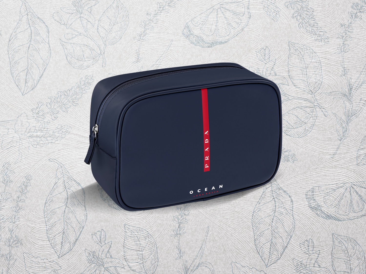 Granatowa kosmetyczka Prada Ocean z czerwoną pionową linią i srebrnym zamkiem błyskawicznym, idealna do przechowywania kosmetyków w podróży.