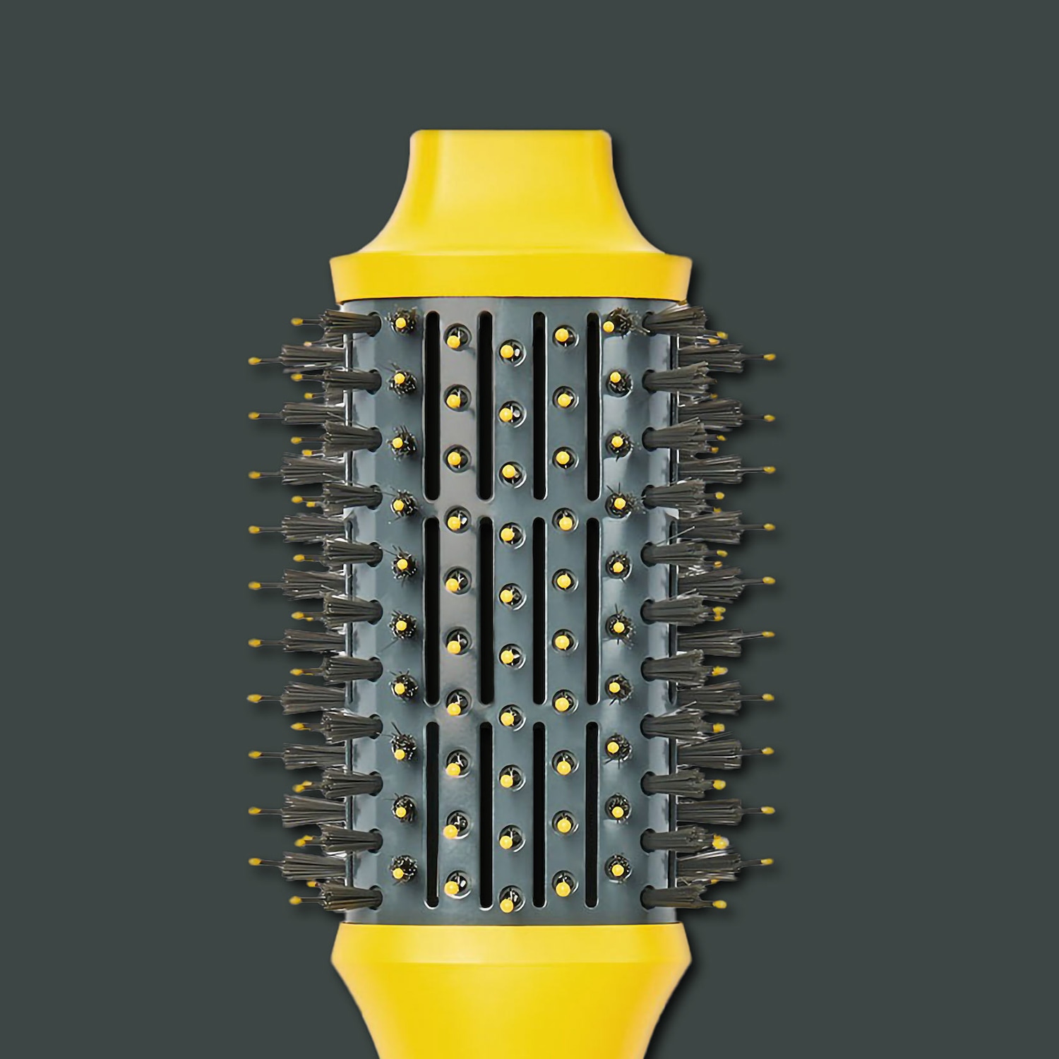 Sárga és szürke színű, hengeres hajkefe, fekete sörtékkel és sárga végekkel.