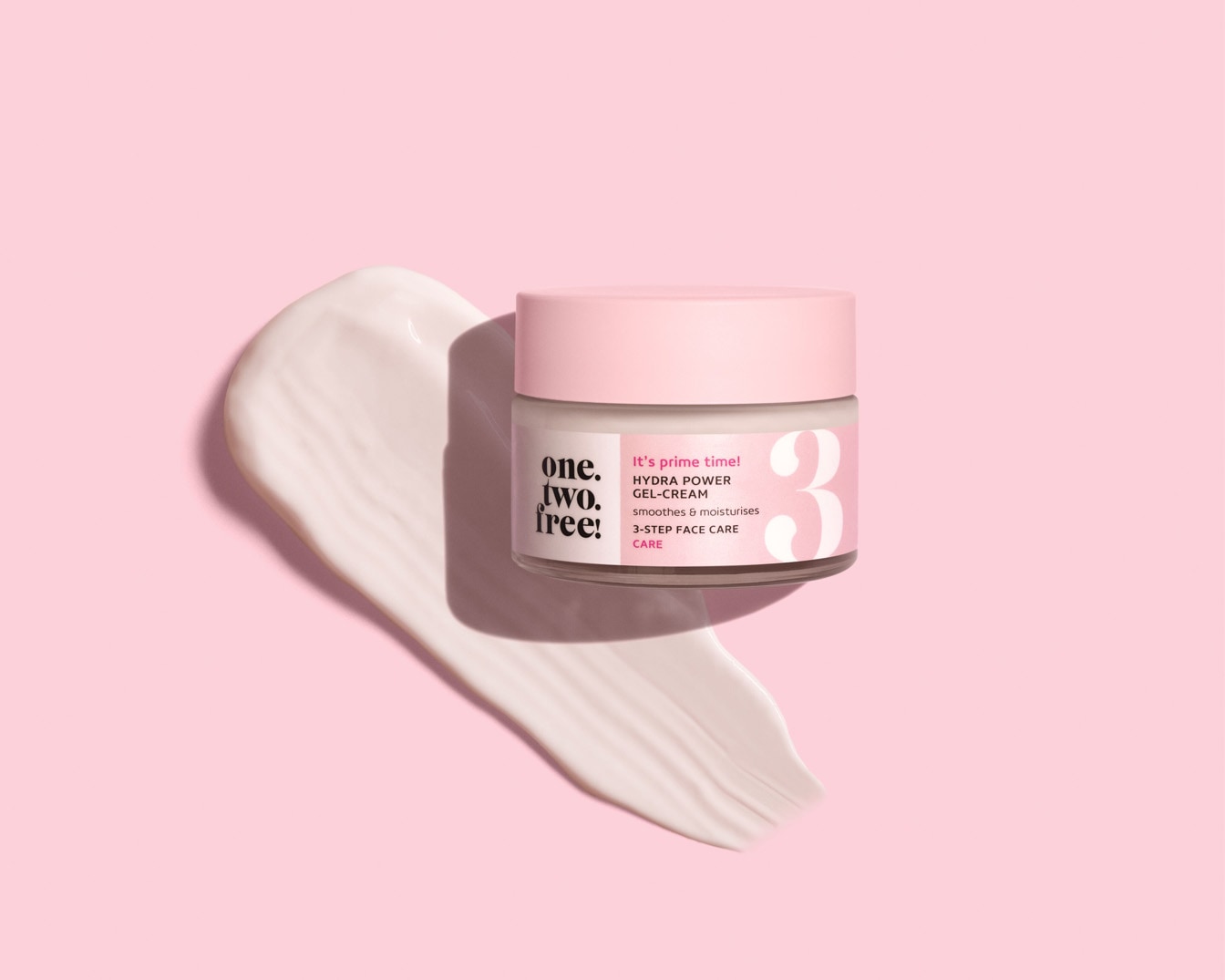 On a pink backdrop, a jar of One.Two.Free! Hydra Power Gel-Cream sits next to a swatch of the cream, promising to smooth and moisturize as part of a 3-step face care routine.