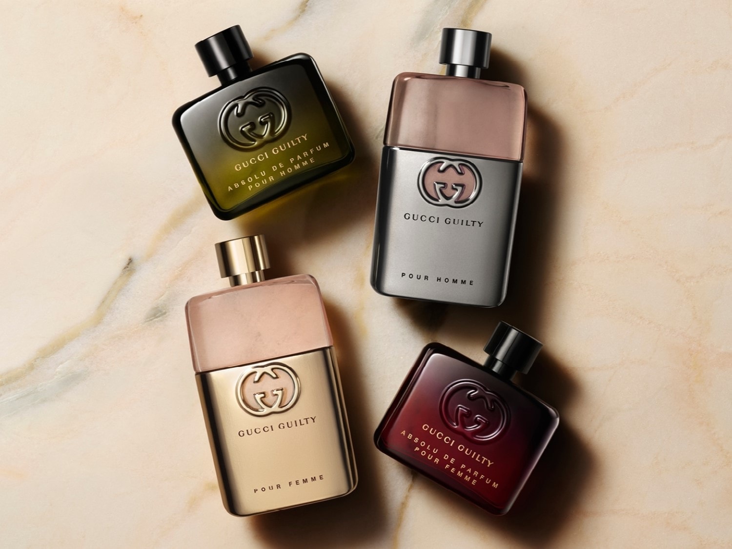 Découvrez le parfum Gucci Guilty dans ses différentes versions pour homme et femme, présentées dans des flacons aux couleurs et finitions variées.