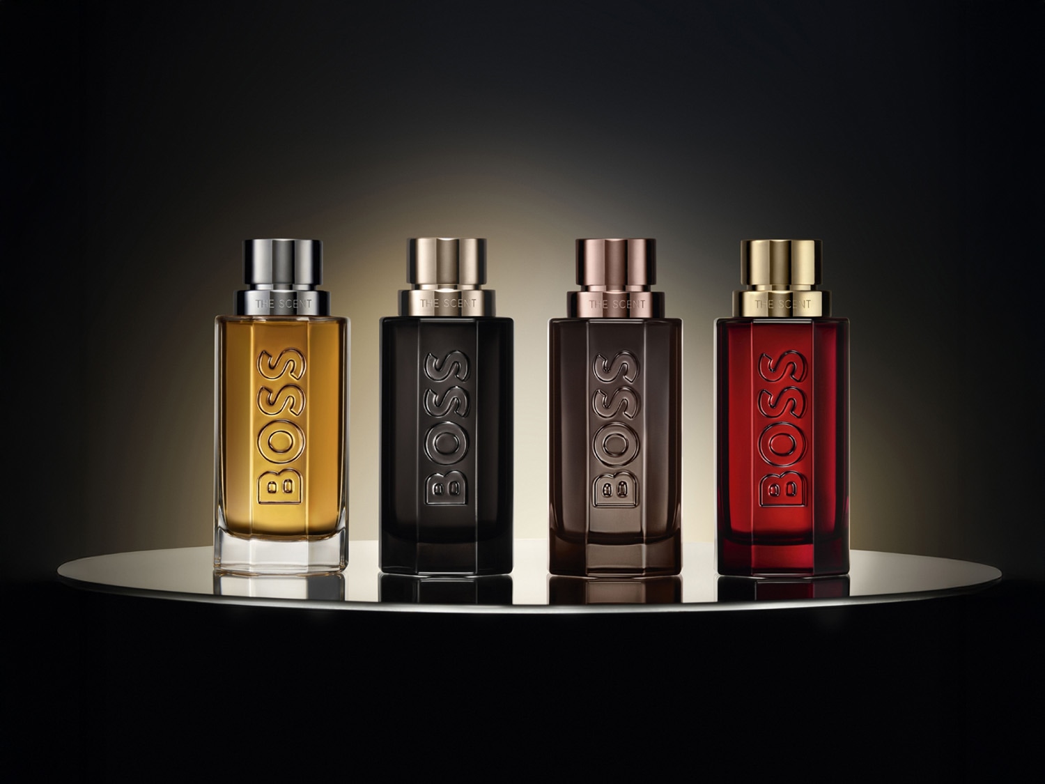 Découvrez la collection de parfums BOSS The Scent, chacun offrant un arôme unique et captivant dans des flacons élégants aux teintes variées.