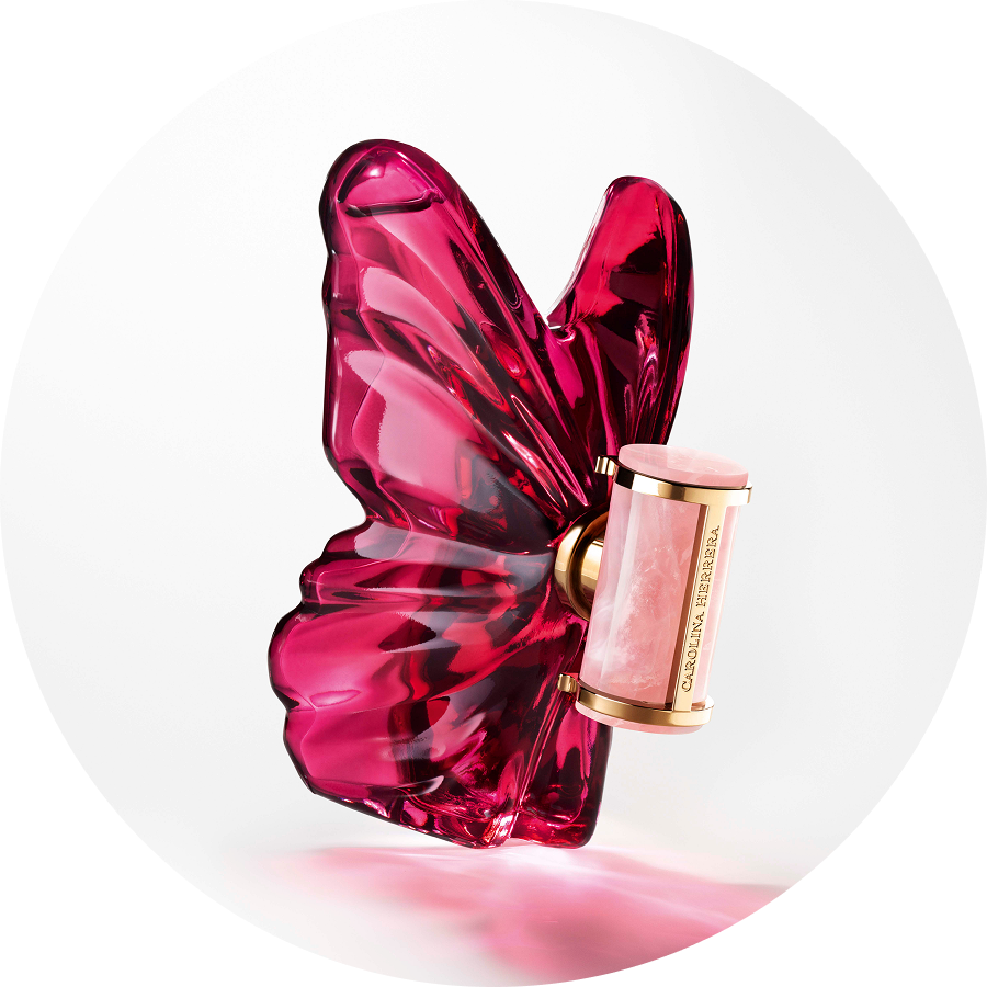 Butelka perfum Carolina Herrera w kształcie różowego motyla z cylindrycznym flakonem, elegancki i kobiecy zapach.