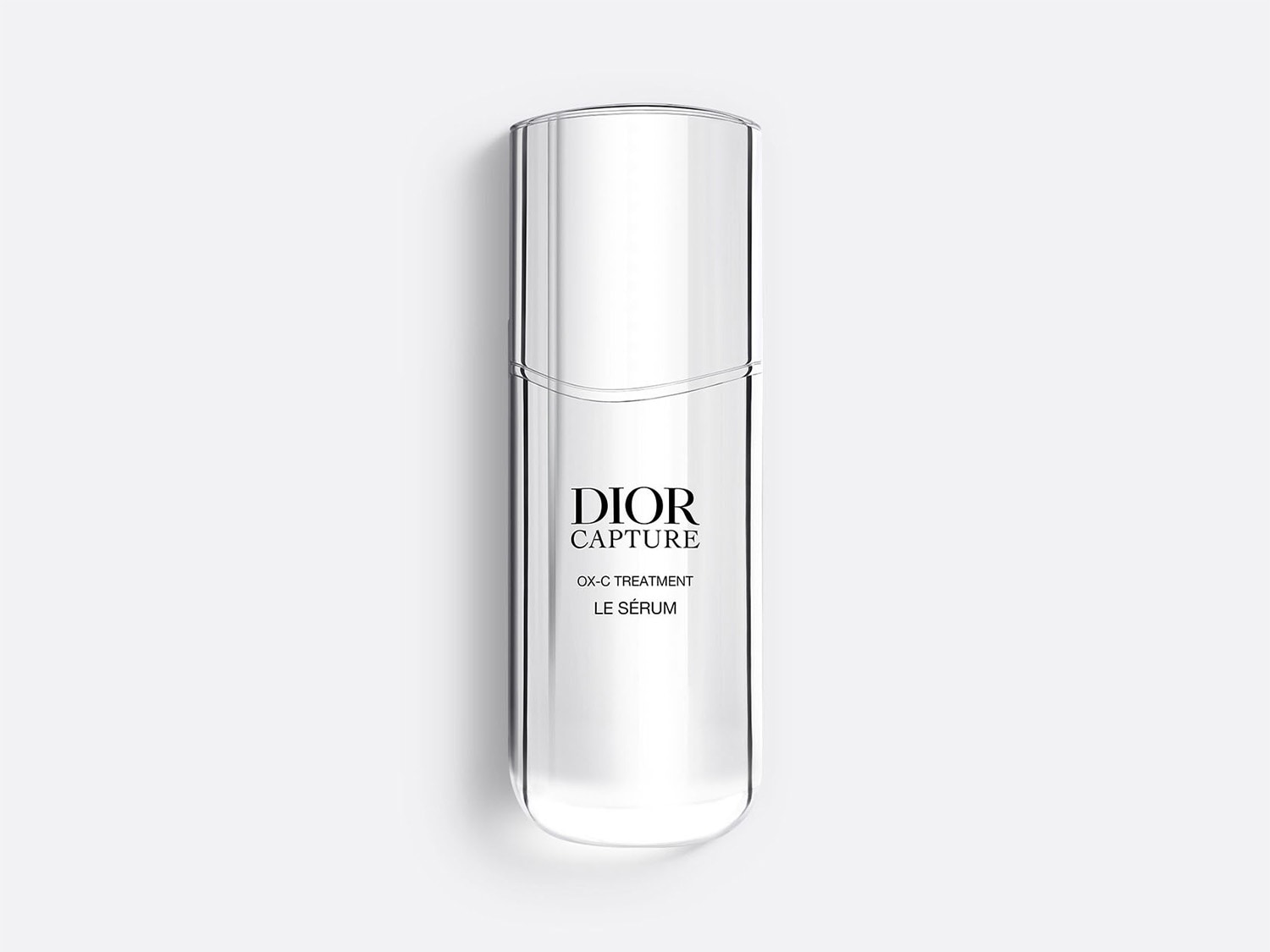 Découvrez le sérum OX-C Treatment Capture de Dior, un soin luxueux dans un flacon transparent élégant, conçu pour revitaliser et illuminer votre peau.