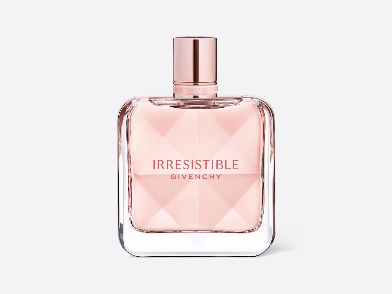 Az Irresistible Givenchy parfüm üvegben, rózsaszín folyadékkal, átlátszó üveggel és rózsaszín kupakkal.