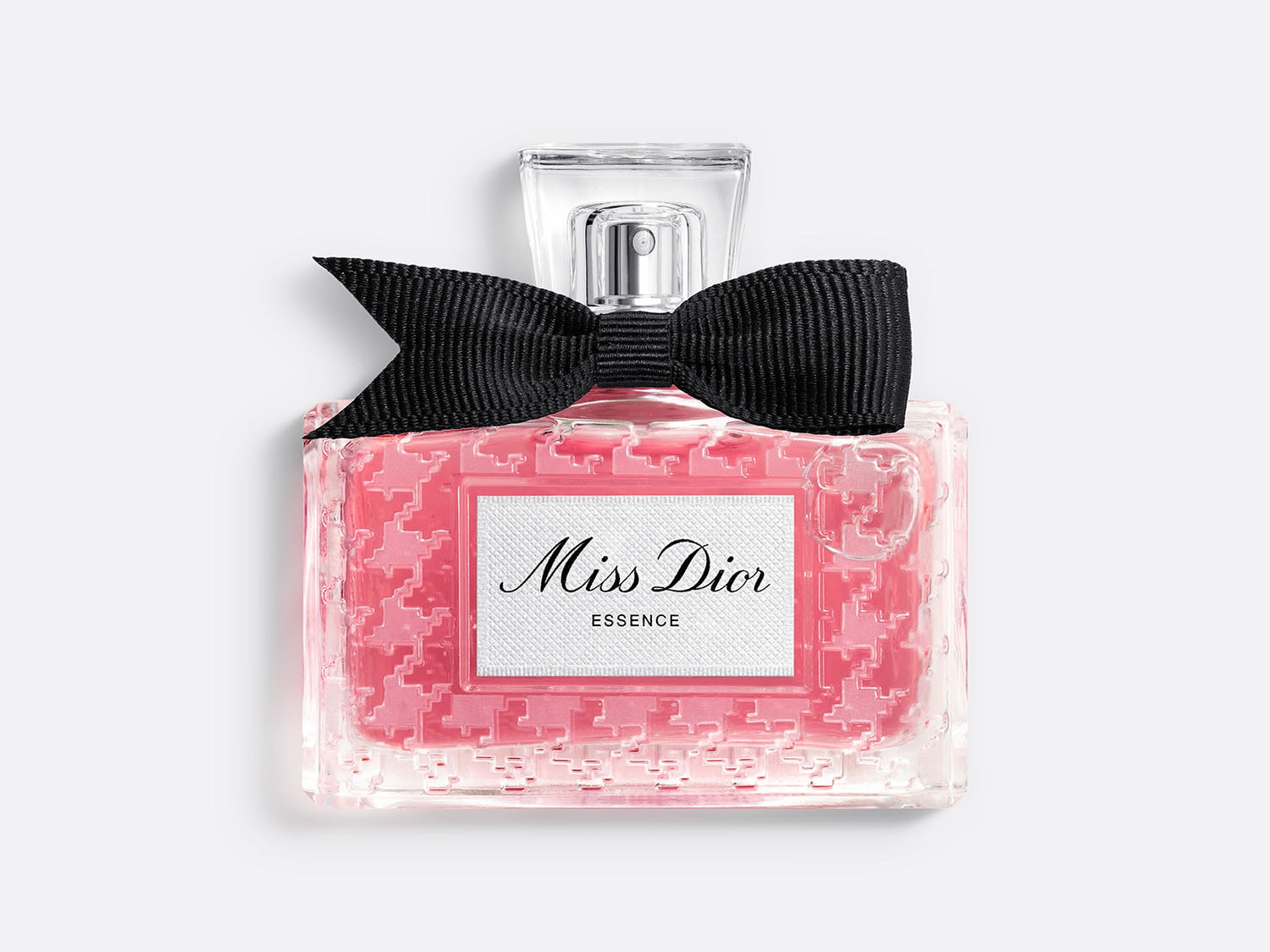 Roze Miss Dior Essence parfumfles met een zwarte strik en een heldere dop.