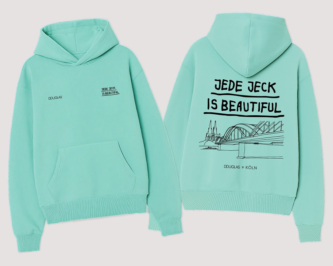 Dieser mintgrüne Kapuzenpullover von Douglas ist mit dem Slogan "Jede Jeck is beautiful" und einer Zeichnung der Kölner Skyline versehen.