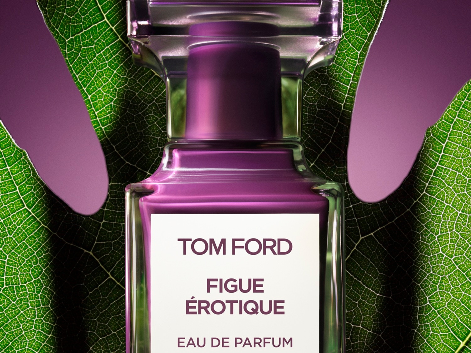 Butelka perfum Tom Ford Fig Érotique Eau de Parfum o pojemności, z zielonym liściem w tle.