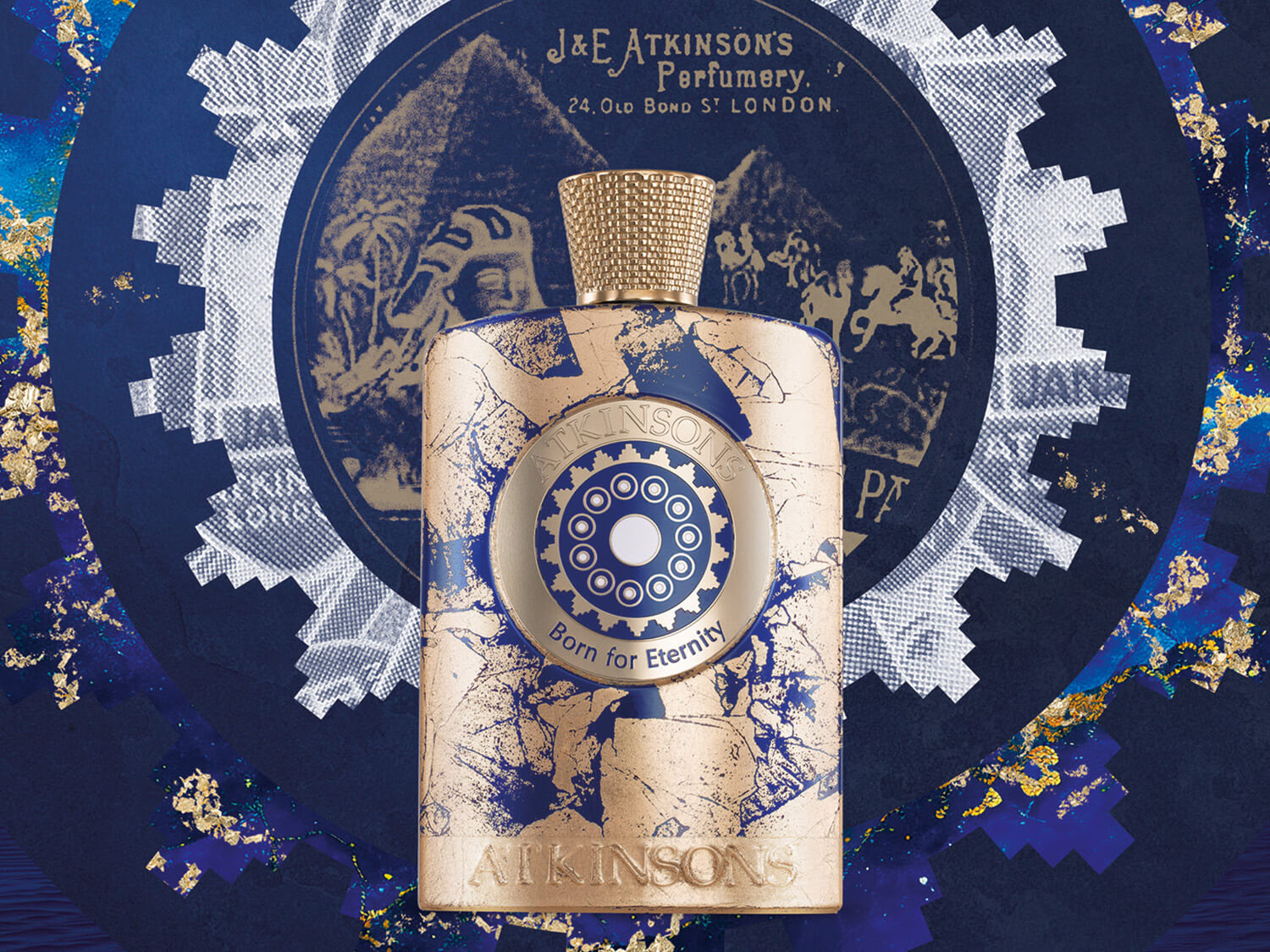 Butelka perfum Atkinson's Born for Eternity w kolorze złotym i niebieskim, z tekstem J&E ATKINSON'S Perfumery, 24 Old Bond St London.