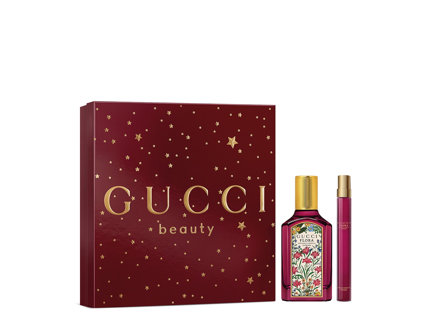 Een bordeauxrode Gucci Beauty geschenkset met gouden sterren, met een fles Flora Intense parfum met bloemmotieven en een rollerball versie.