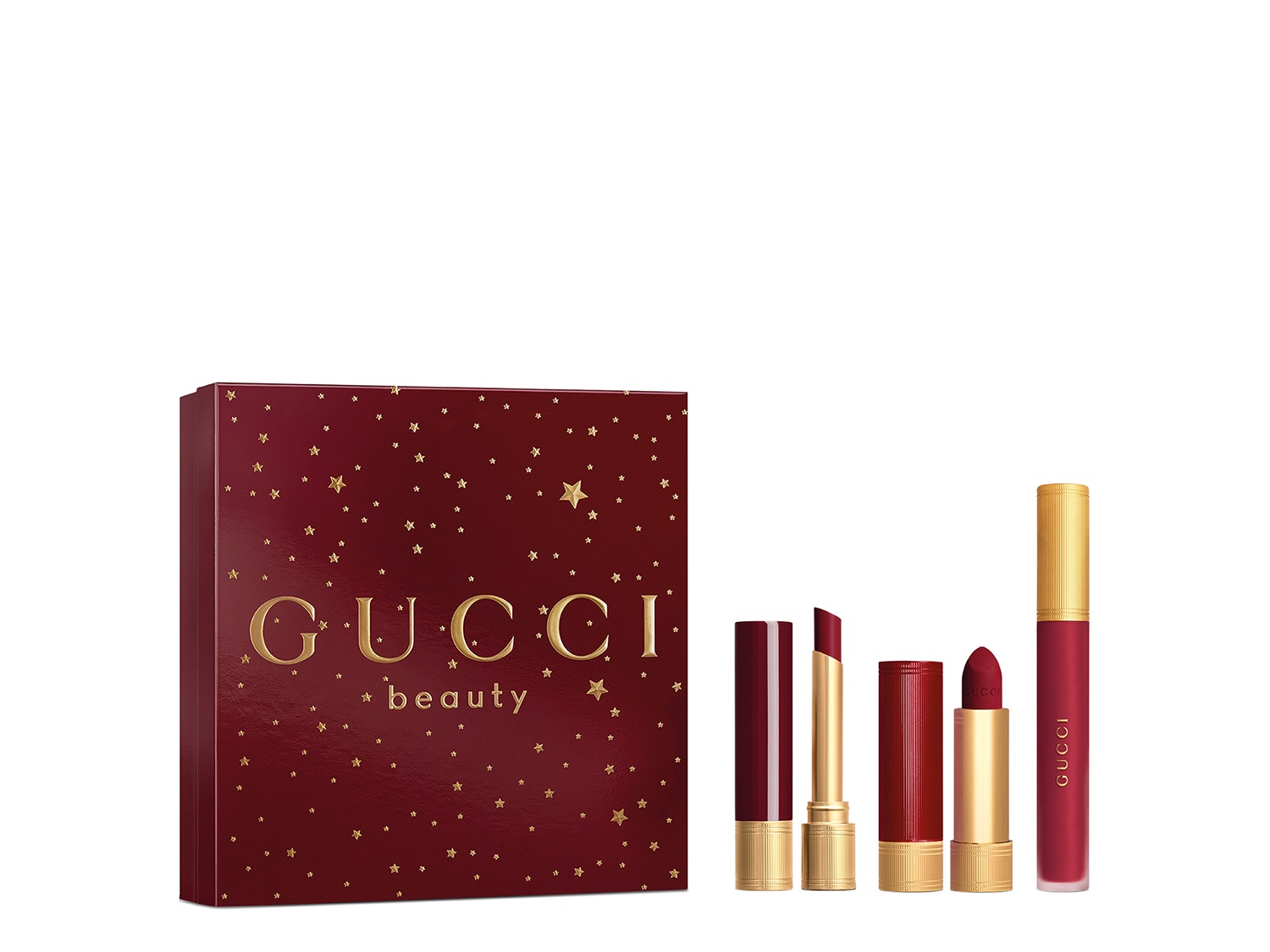 Ontdek de Gucci Beauty-set, verpakt in een bordeauxrode doos met gouden sterren, inclusief lippenstift en lipgloss in rijke, rode tinten.
