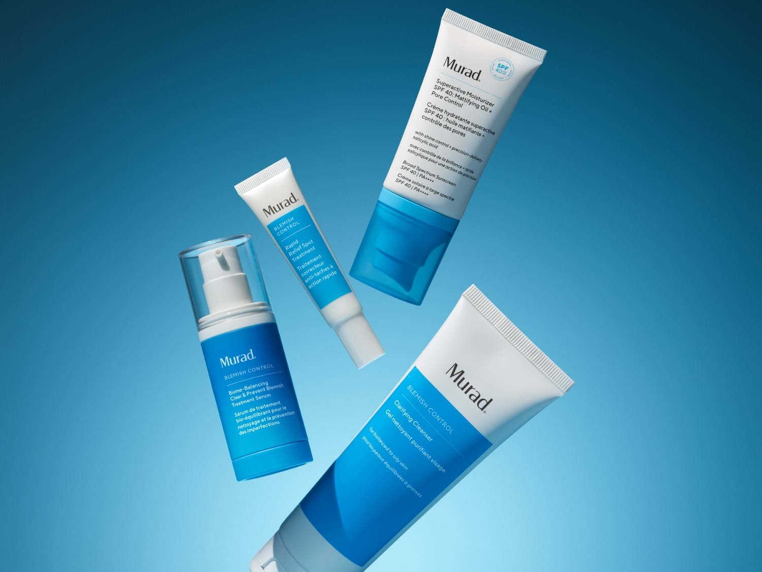 Kolekcja Murad Blemish Control zawiera krem nawilżający SPF 40, serum i żel oczyszczający w białych opakowaniach z niebieskimi akcentami, idealne do pielęgnacji skóry problematycznej.