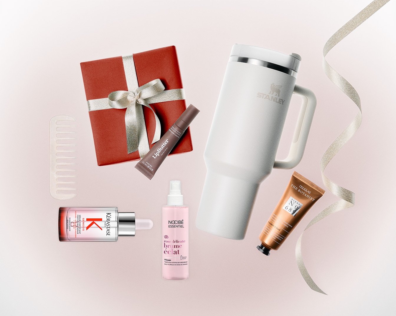 Découvrez un assortiment de produits de beauté et d'accessoires, comprenant un coffret cadeau rouge, un baume à lèvres LipButter, une brume éclat rose délicate de Nocibé, un sérum Kérastase et une crème pour les mains Douglas The Botanist.