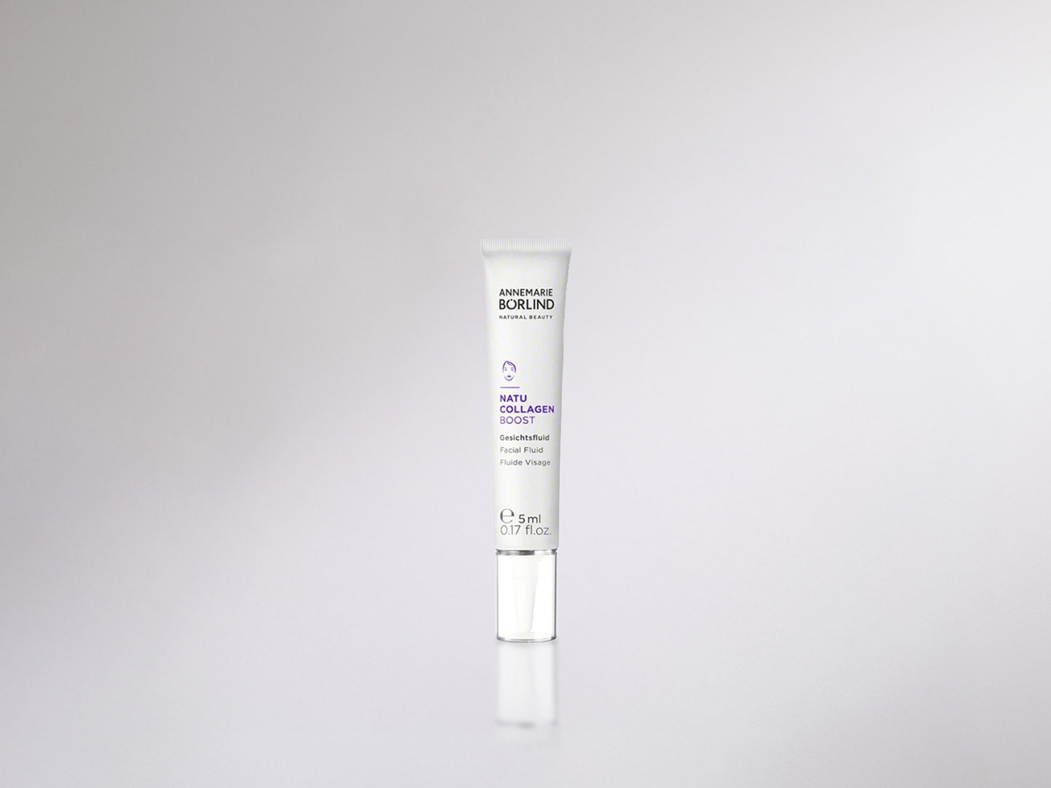 Das Annemarie Börlind Natu Collagen Boost Gesichtsfluid in einer weißen Tube mit lila Akzenten für natürliche Schönheit.