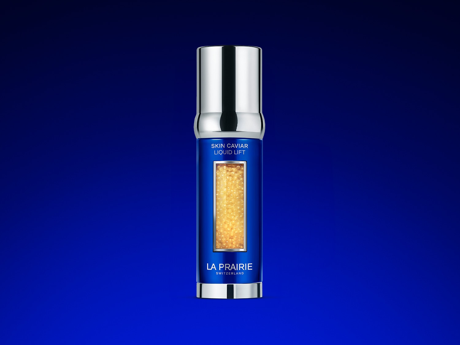 Blaue La Prairie Skin Caviar Liquid Lift Flasche mit silbernem Verschluss und goldenen Kaviarperlen, die für einen straffenden Effekt sorgen.