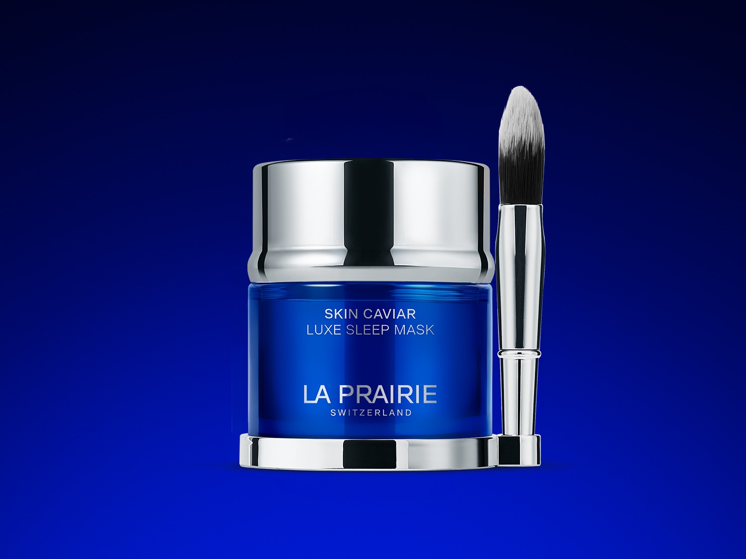 Blaue La Prairie Skin Caviar Luxe Sleep Mask mit silbernem Deckel und Pinsel für die Anwendung.