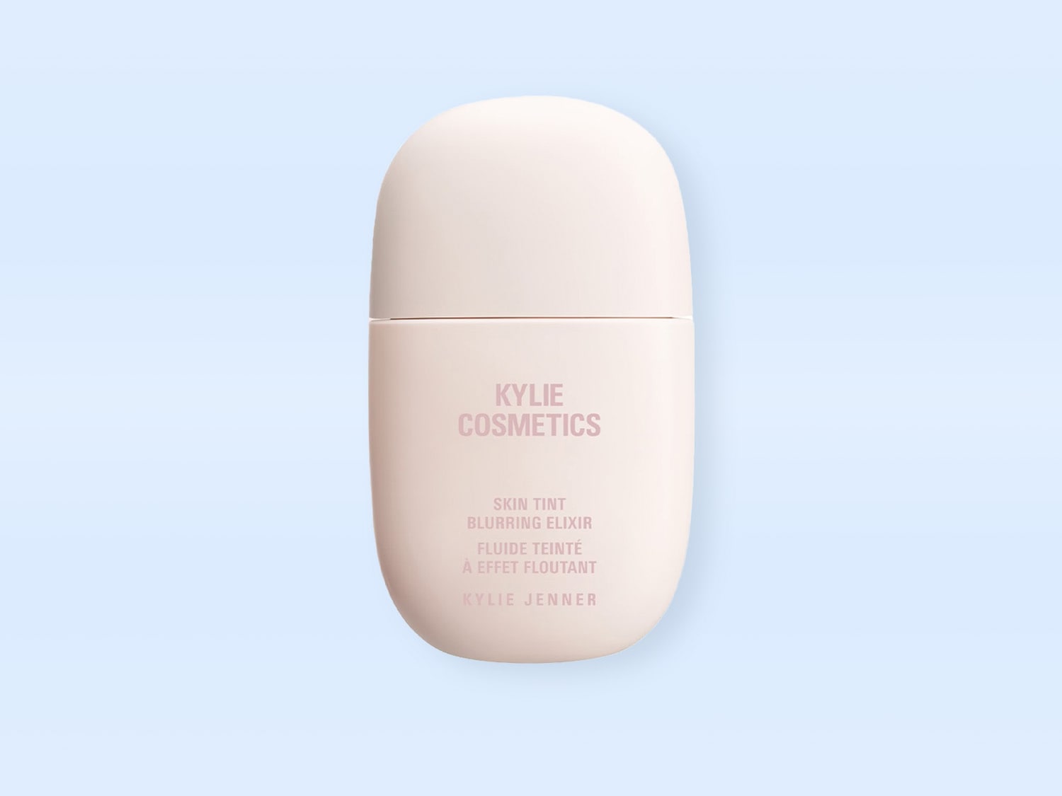 Helle, mandelförmige Flasche mit der Aufschrift 'Kylie Cosmetics Skin Tint Blurring Elixir', die ein Hautton- und Unschärfe-Elixier von Kylie Jenner bewirbt.