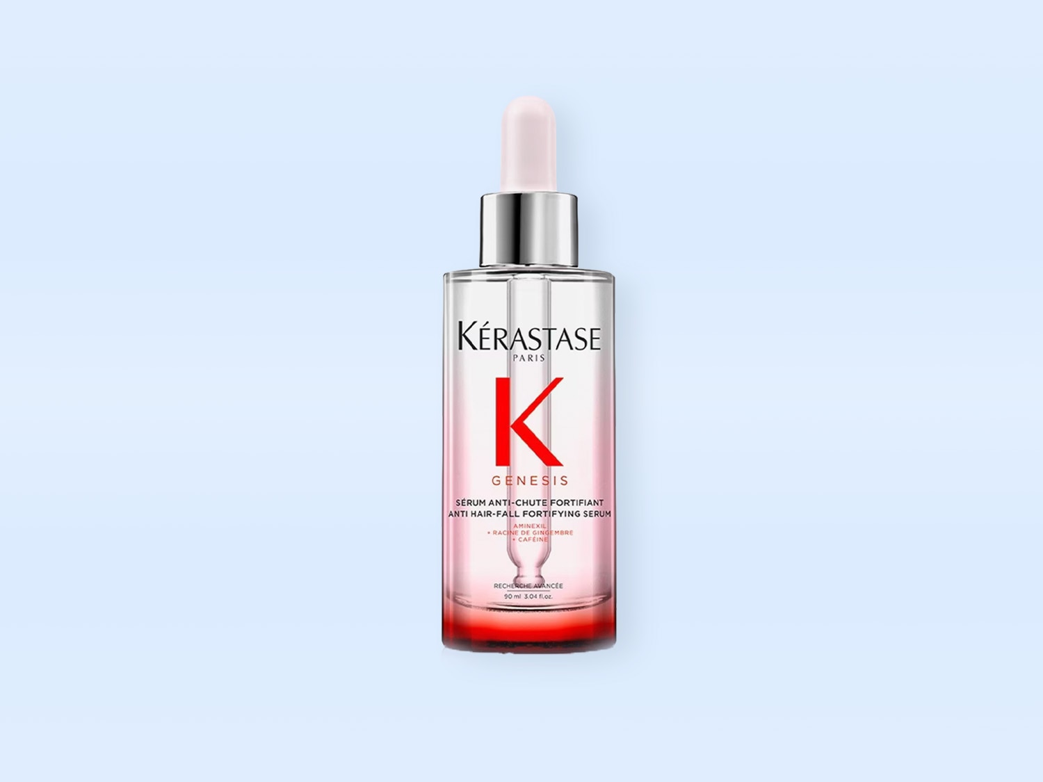 Das Kérastase Génesis Serum Anti-Chute Fortifiant in einer durchsichtigen Glasflasche mit einem silbernen Applikator und einem rosa Farbverlauf von klar zu rot ist ein Anti-Haarausfall-Serum.