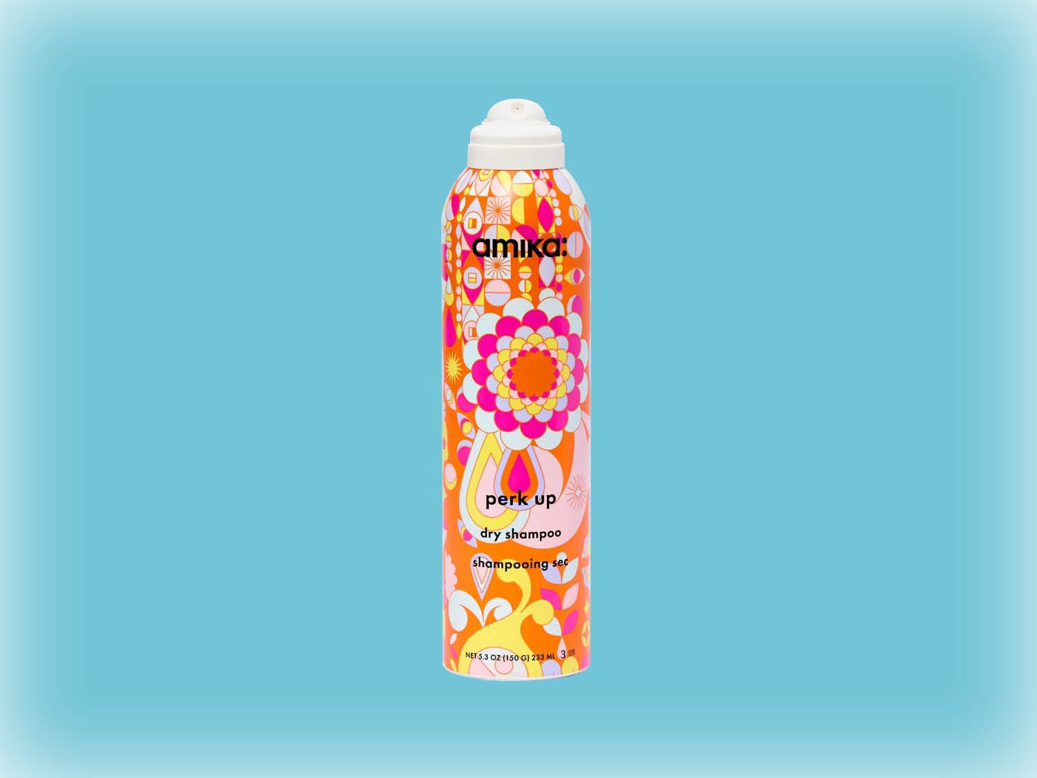 Voici un vaporisateur de shampooing sec Amika Perk Up avec un motif floral orange, rose et blanc.