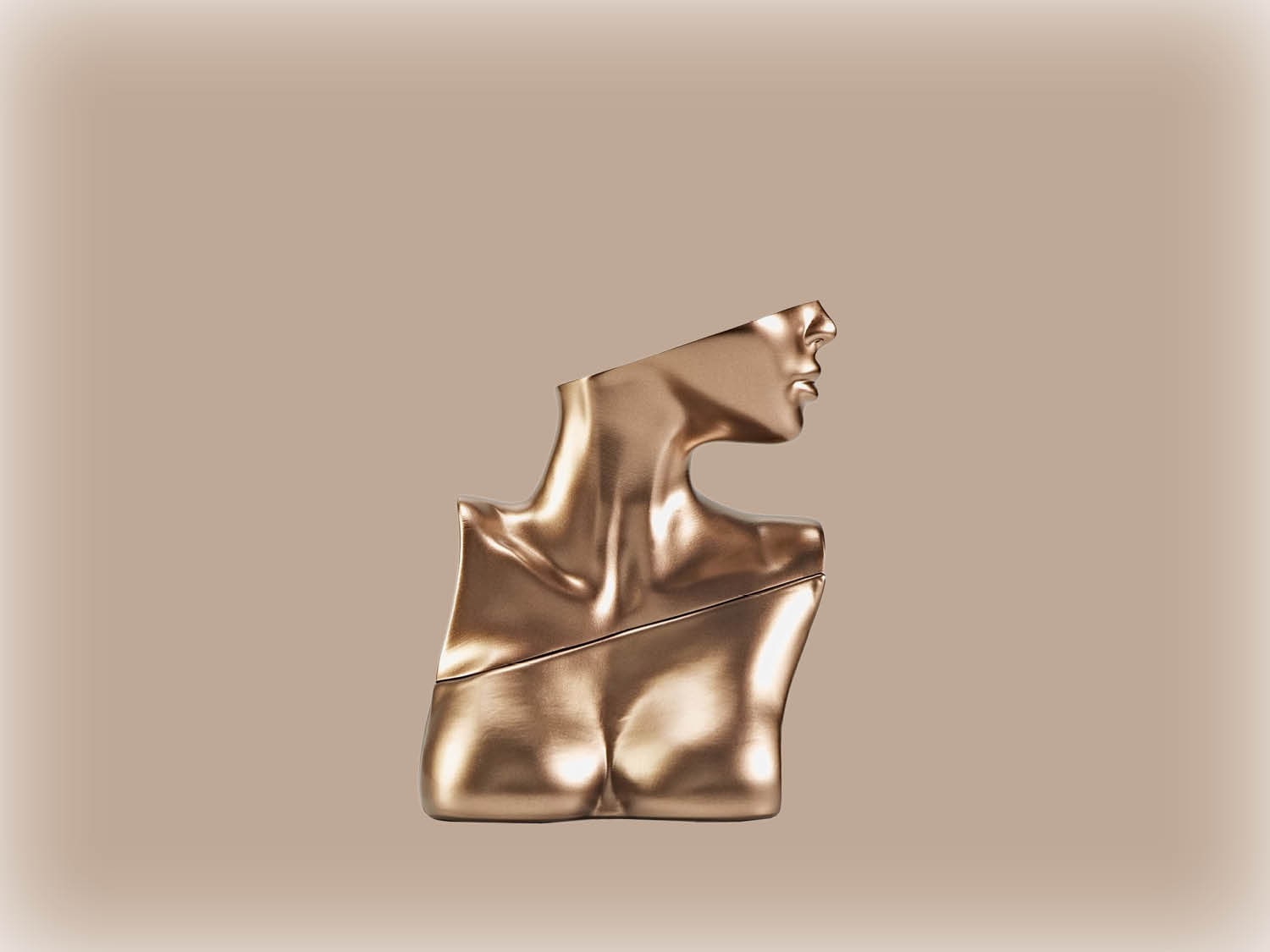 Le flacon de parfum doré en forme de buste féminin, une œuvre d'art olfactive.