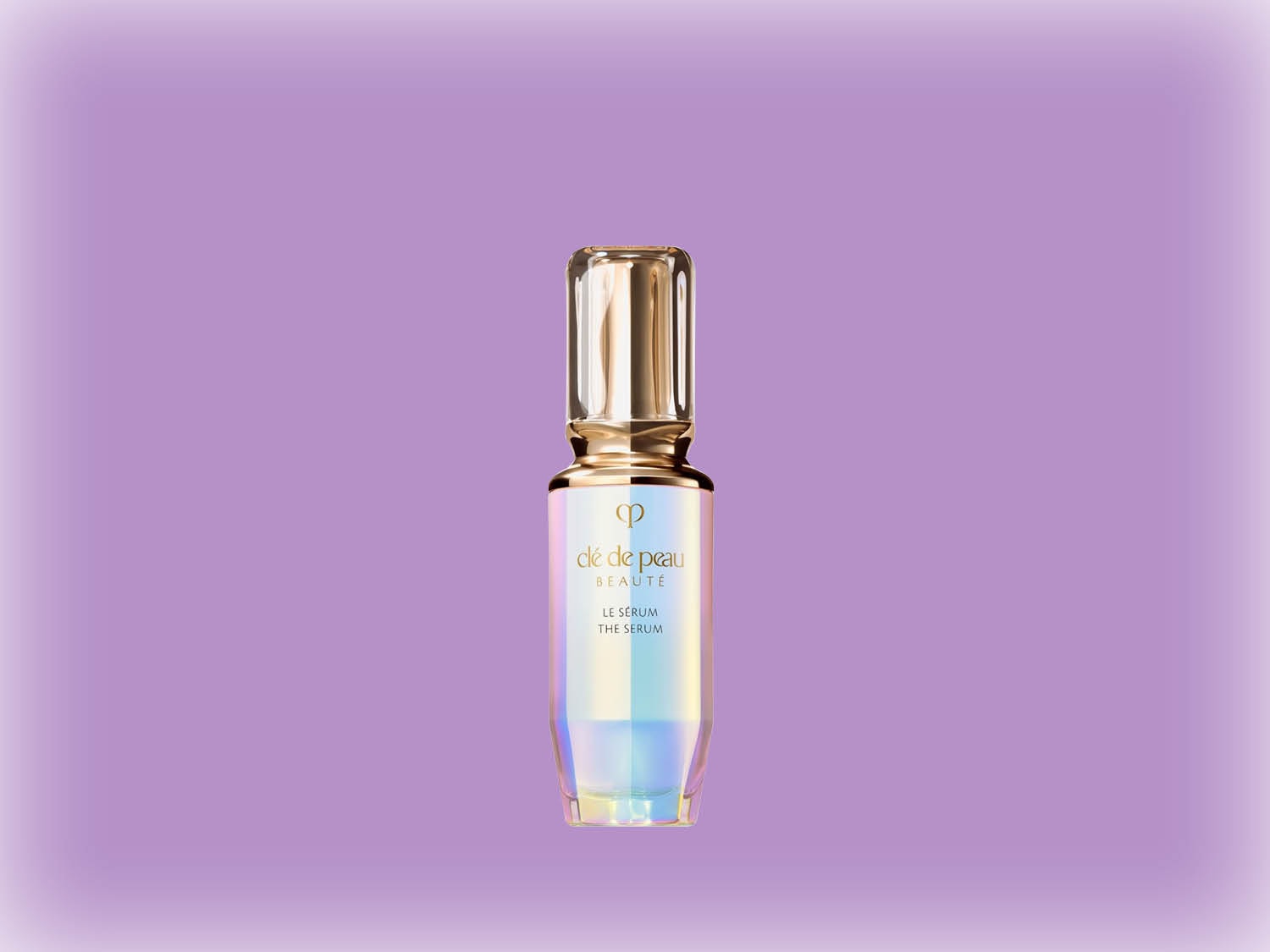 Découvrez le sérum Clé de Peau Beauté, un élixir de beauté dans un flacon irisé sur fond violet, pour une peau éclatante et revitalisée.