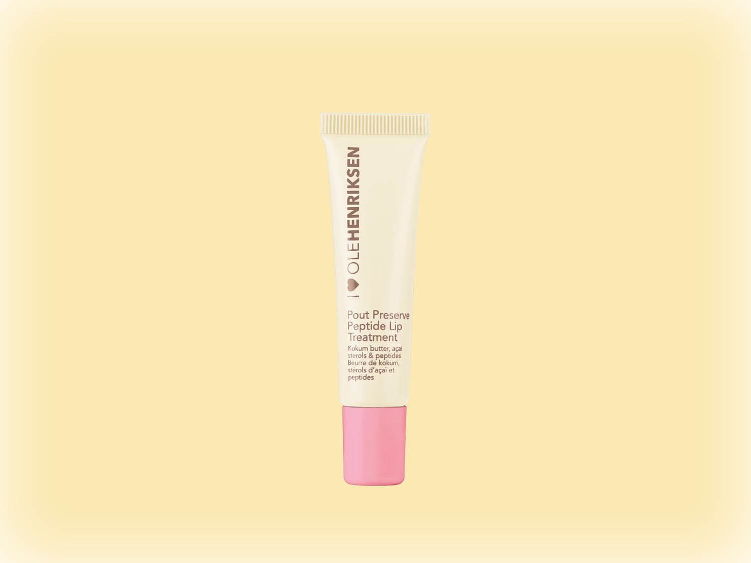 Voici le soin des lèvres Pout Preserve Peptide d'Olehenriksen dans un tube blanc avec un bouchon rose, infusé de beurre de kokum, de stérols d'açaï et de peptides pour des lèvres pulpeuses et hydratées.