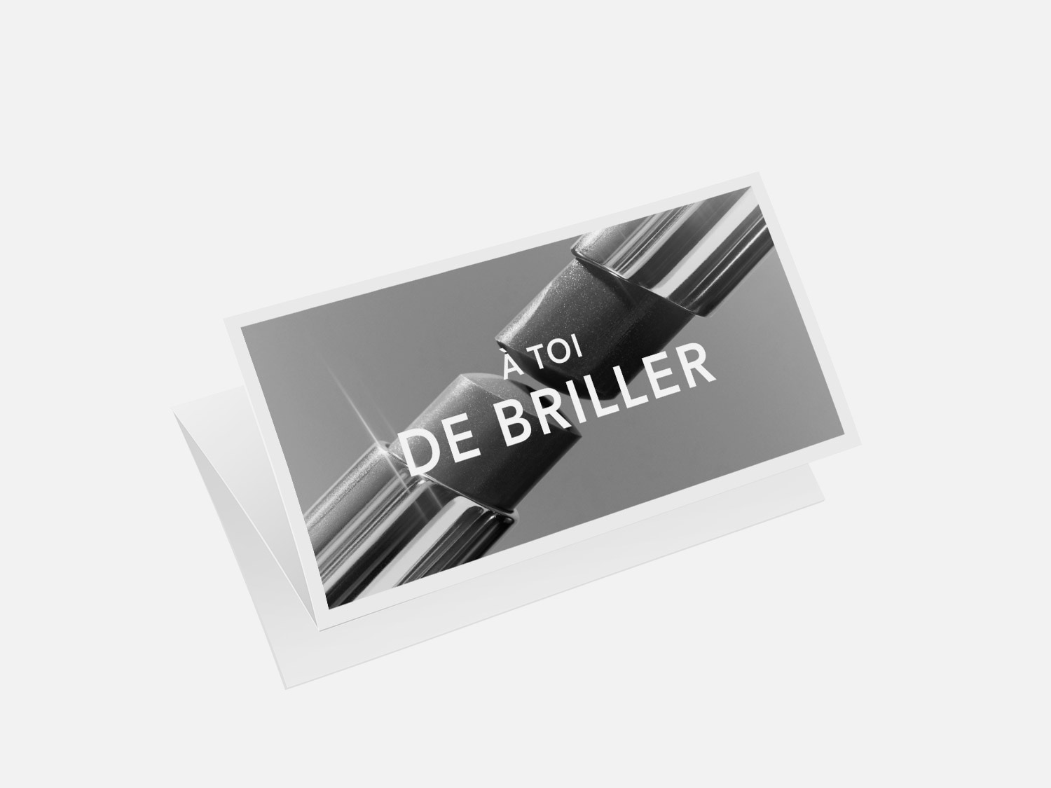 Carte de vœux en gros plan avec le message "À toi de briller" écrit en blanc sur un fond gris, suggérant un message d'encouragement et d'éclat.