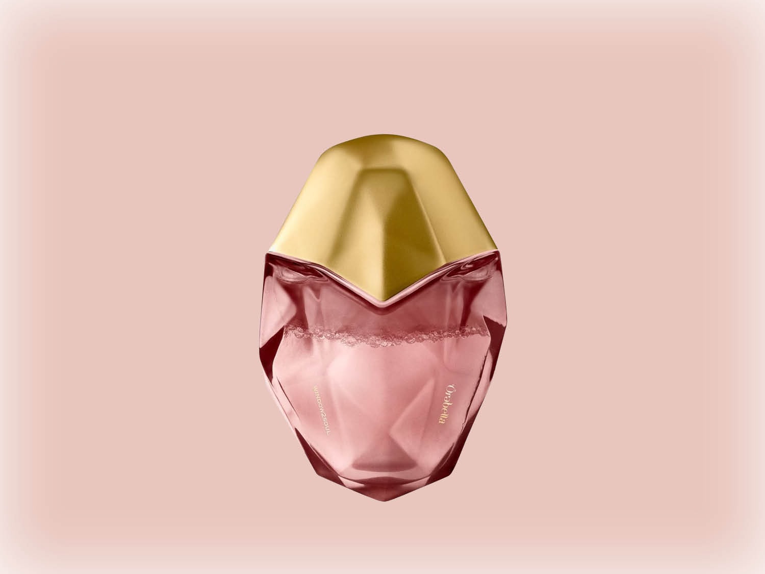 Le flacon de parfum Orabella présente une forme géométrique rose avec un bouchon doré, évoquant une sensation de luxe et de féminité.