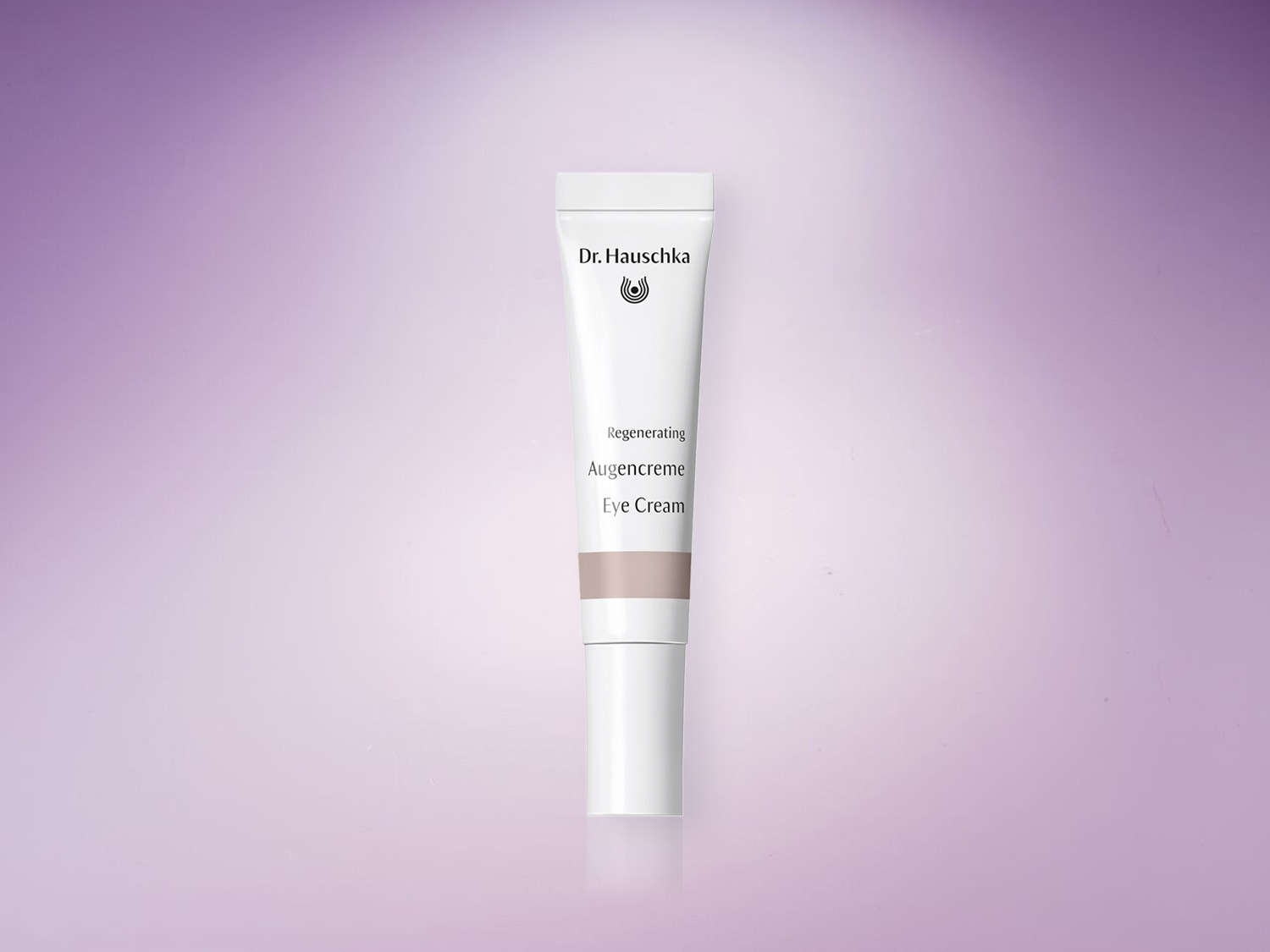 Voici le tube blanc de la crème contour des yeux régénérante Dr. Hauschka, conçu pour revitaliser et lisser la peau délicate autour des yeux.