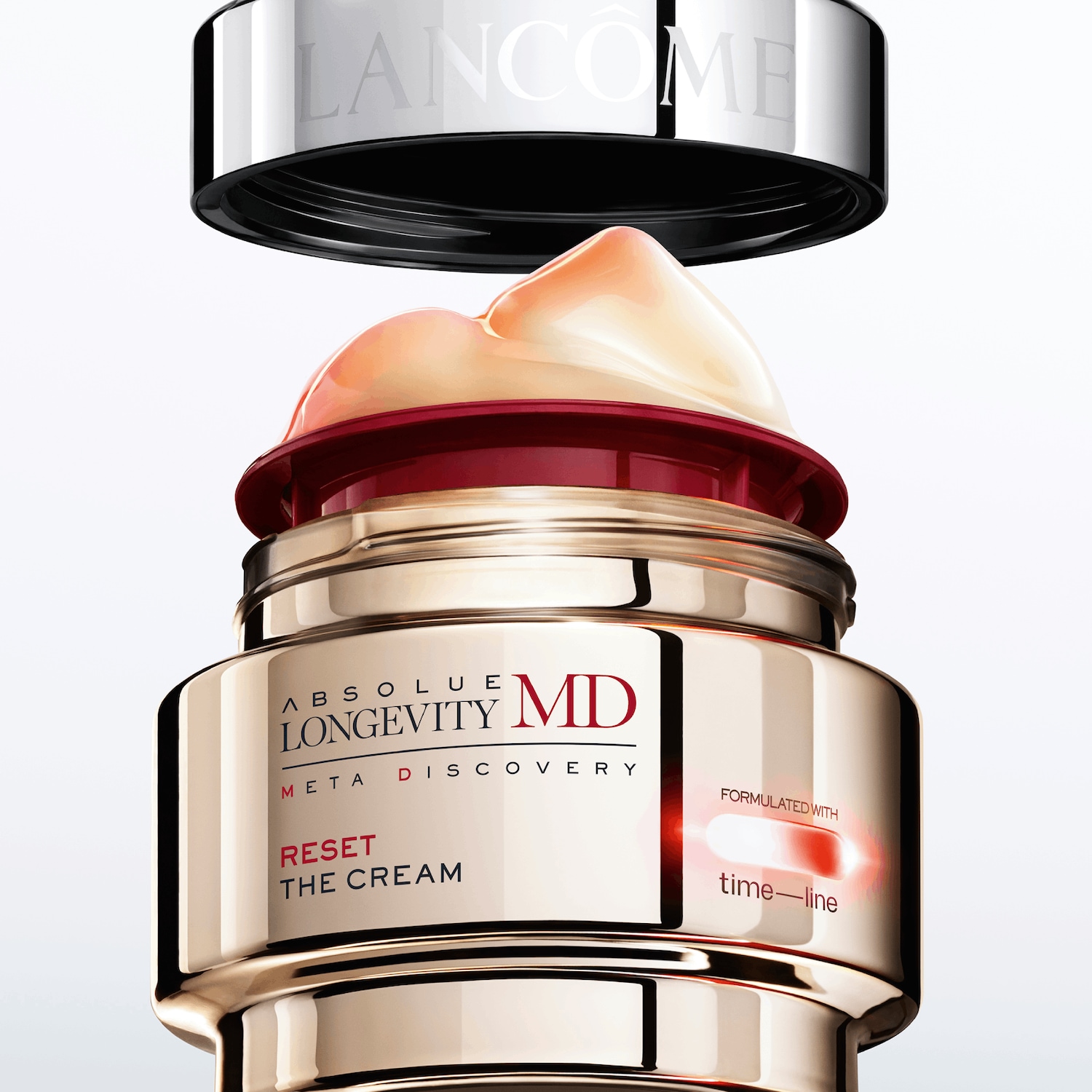 Découvrez Absolue Longevity MD Meta Discovery Reset The Cream de Lancôme, un soin formulé avec time-line, présenté dans un élégant pot doré avec un couvercle argenté.