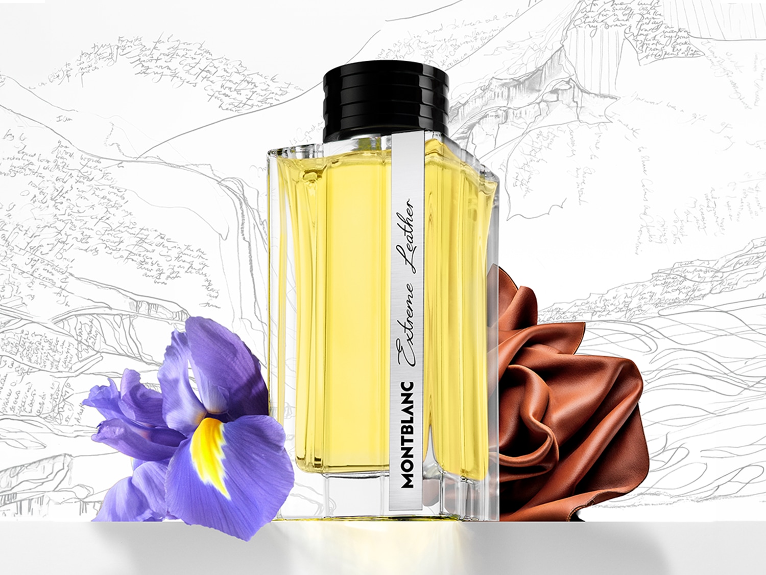 Butelka perfum Montblanc Extreme Leather z żółtą cieczą, ozdobiona fioletowym irysem i brązową skórą, na tle szkicu górskiego krajobrazu.