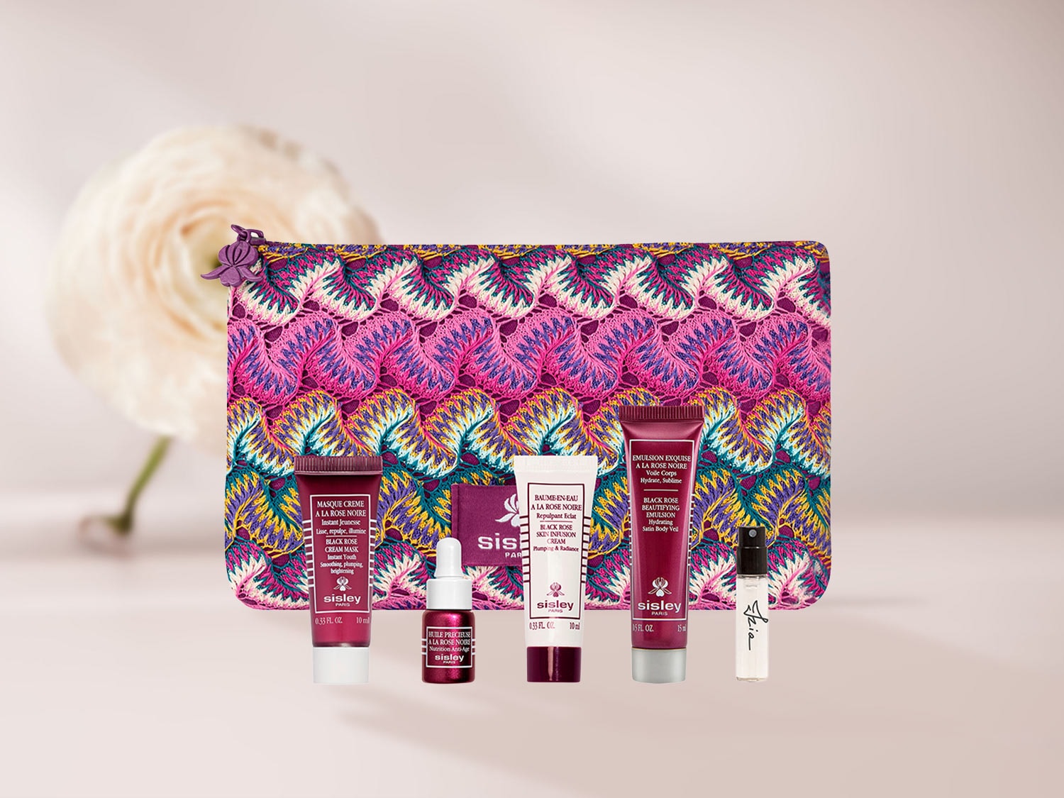 Entdecken Sie das Sisley Black Rose Set mit einer bunten Kosmetiktasche, Maske, Öl, Creme und Emulsion für eine jugendliche und strahlende Haut.