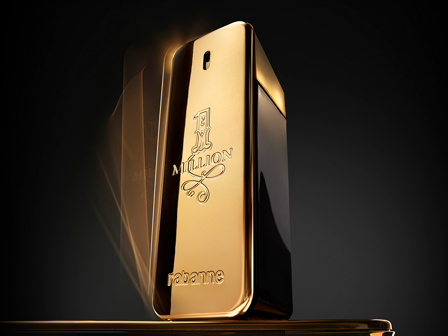 Paco Rabanne 1 Million to męska woda perfumowana w eleganckim, złotym flakonie w kształcie sztabki złota, z wygrawerowanym napisem "1 Million" i "rabanne".
