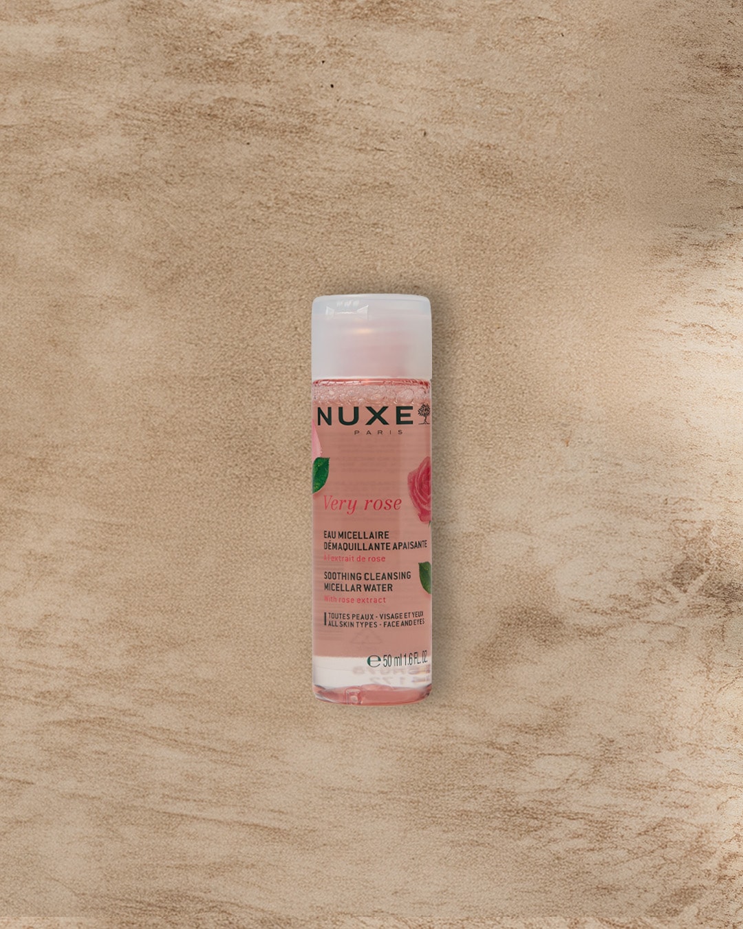 Nuxe Very Rose Mizellenwasser mit Rosenextrakt in einer durchsichtigen Flasche mit rosa Akzenten, ideal für alle Hauttypen, Gesicht und Augen.