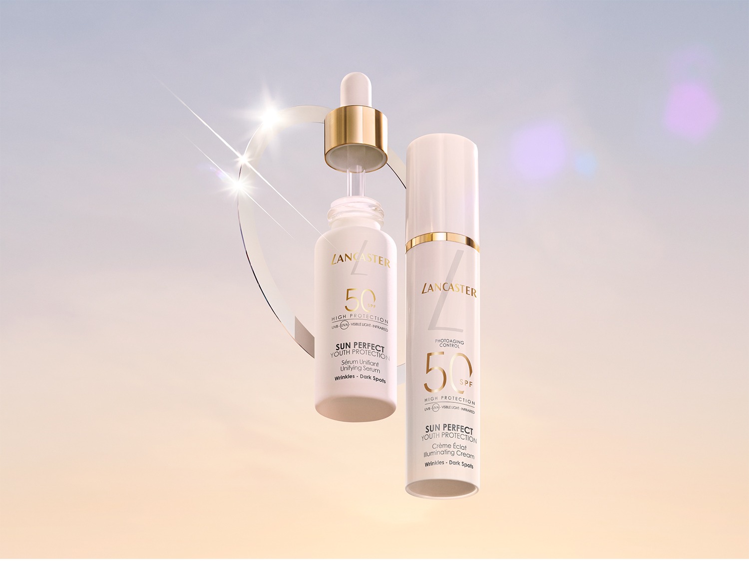 Twee witte Lancaster Sun Perfect Youth Protection-flessen, een serum en een crème, zweven tegen een zachte achtergrond, beide met SPF 50 voor bescherming tegen rimpels en donkere vlekken.