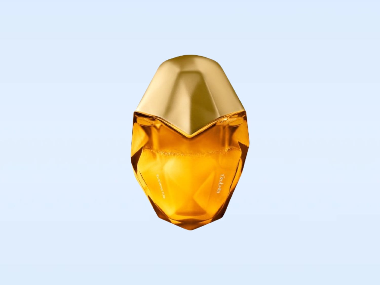 Ecco una bottiglia di profumo dorata con un tappo dorato a forma di gemma, che promette un'esperienza olfattiva lussuosa ed elegante.