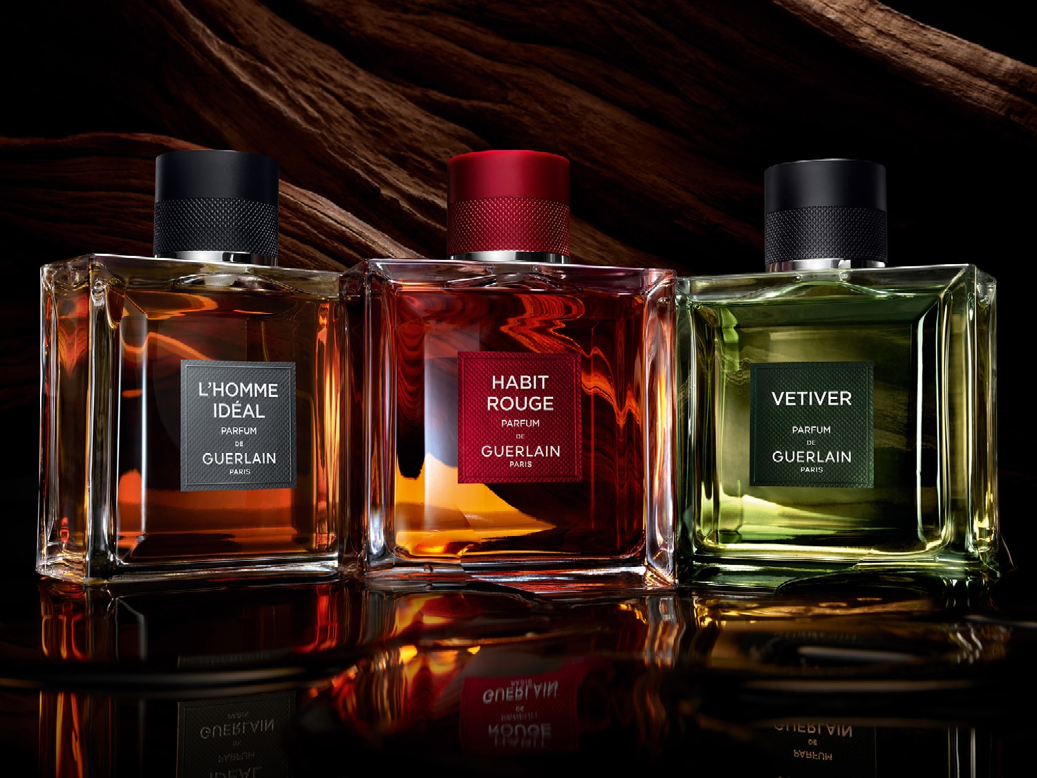 Imaginea prezintă 3 parfumuri bărbătești Guerlain: Habitat Rouje, Vetiver și L'Homme Ideal.